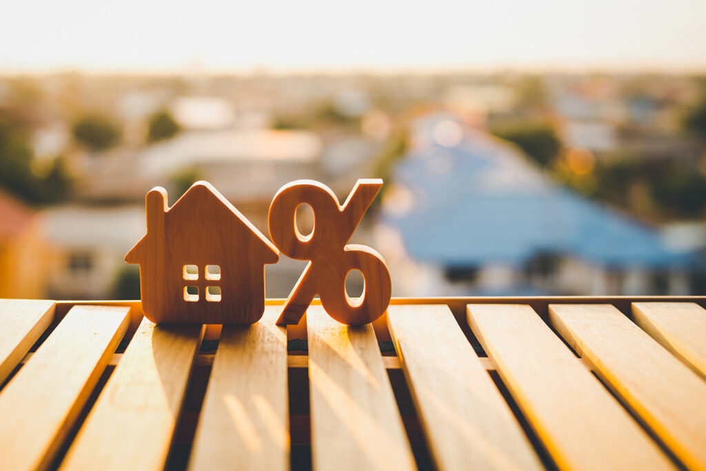 Percentage and house sign symbol icon wooden on wood table